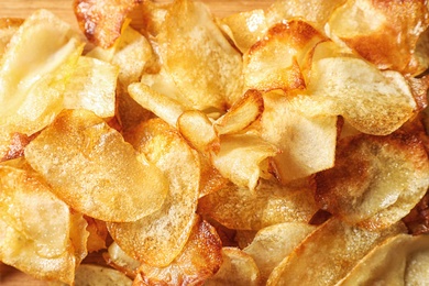 Photo of Crispy potato chips as background