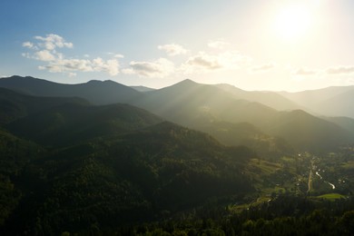 Image of Aerial view of beautiful mountain landscape with forest on sunny day. Drone photography