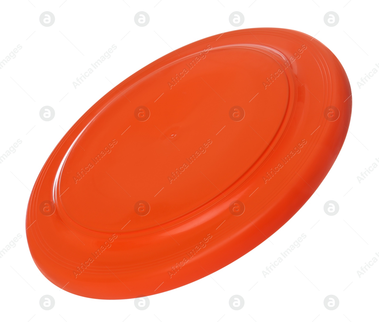 Photo of Orange plastic frisbee disk isolated on white