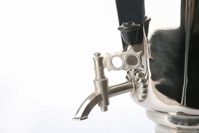 Closeup view of traditional Russian samovar on white background. Faucet detail