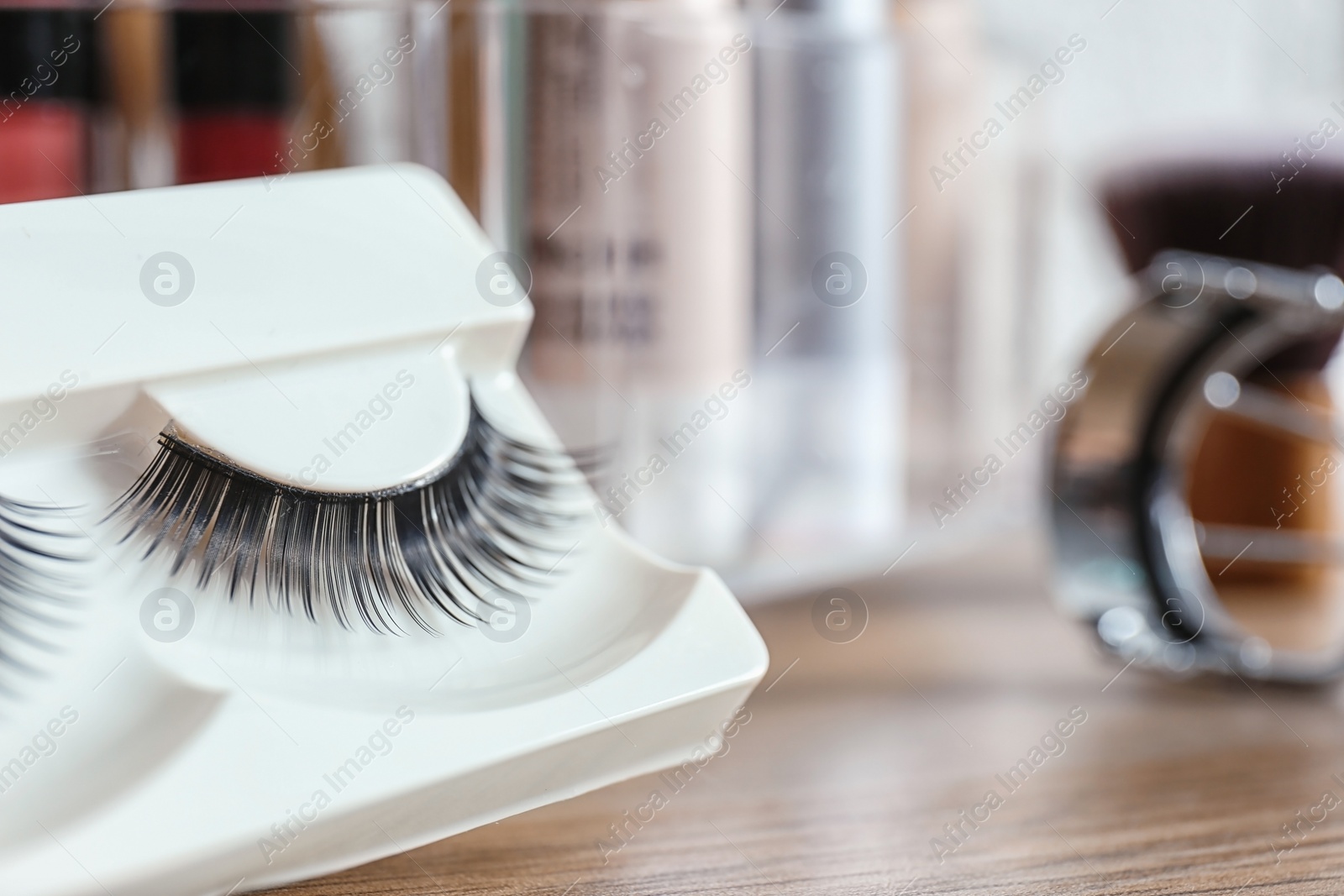 Photo of False eyelashes for makeup on table, closeup