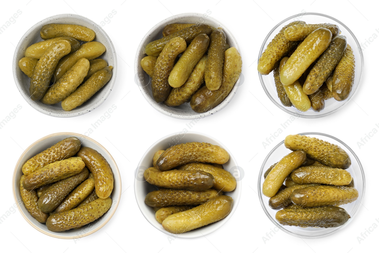 Image of Tasty pickled cucumbers in bowls isolated on white, top view