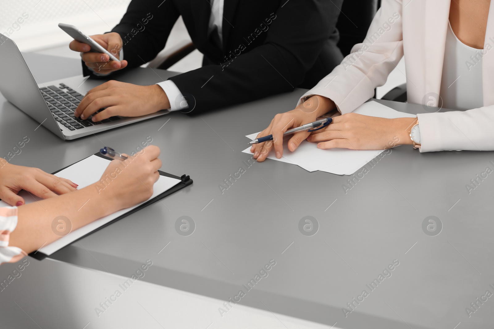 Photo of Human resources commission conducting job interview with applicant in office, closeup