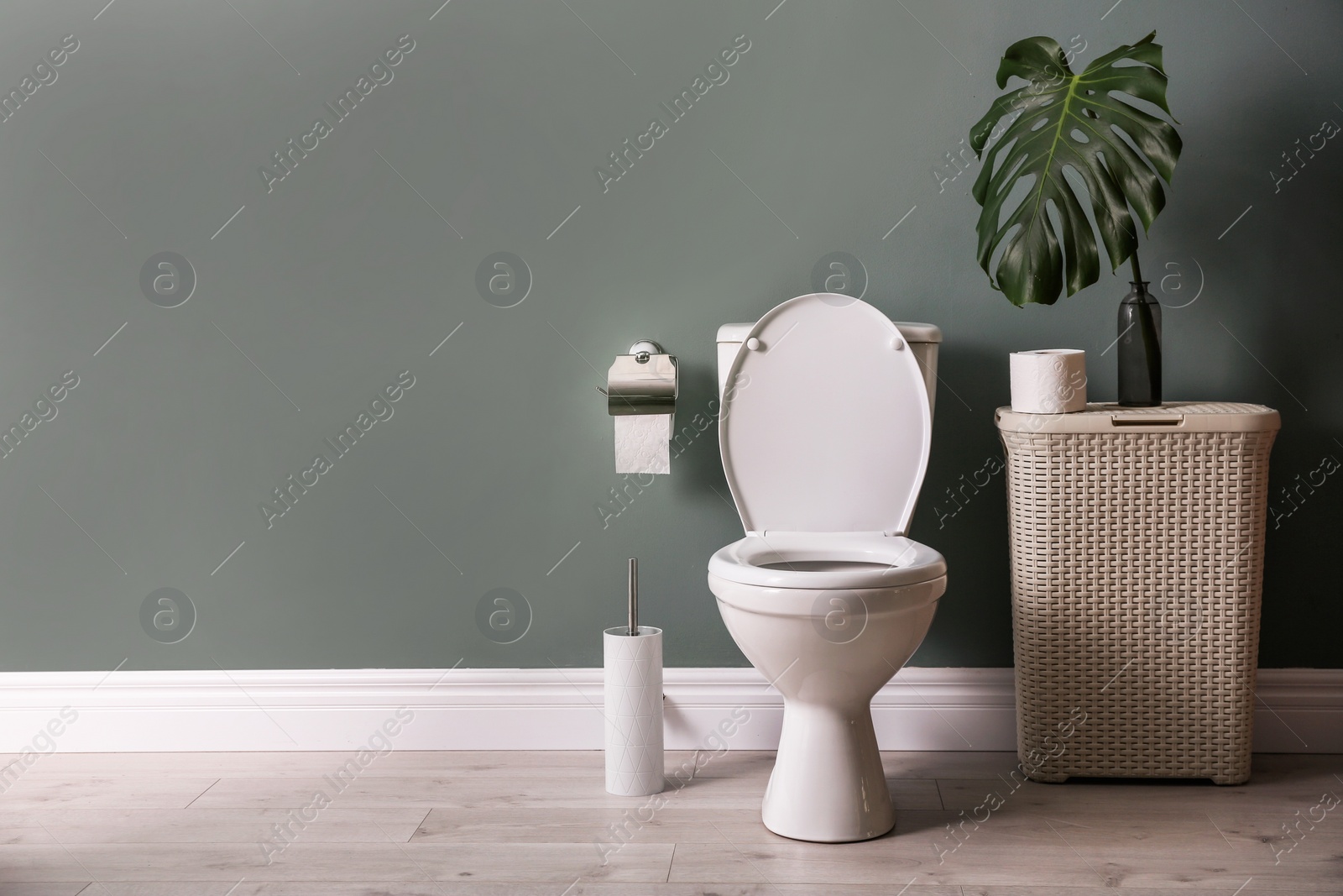 Photo of New ceramic toilet bowl in modern bathroom