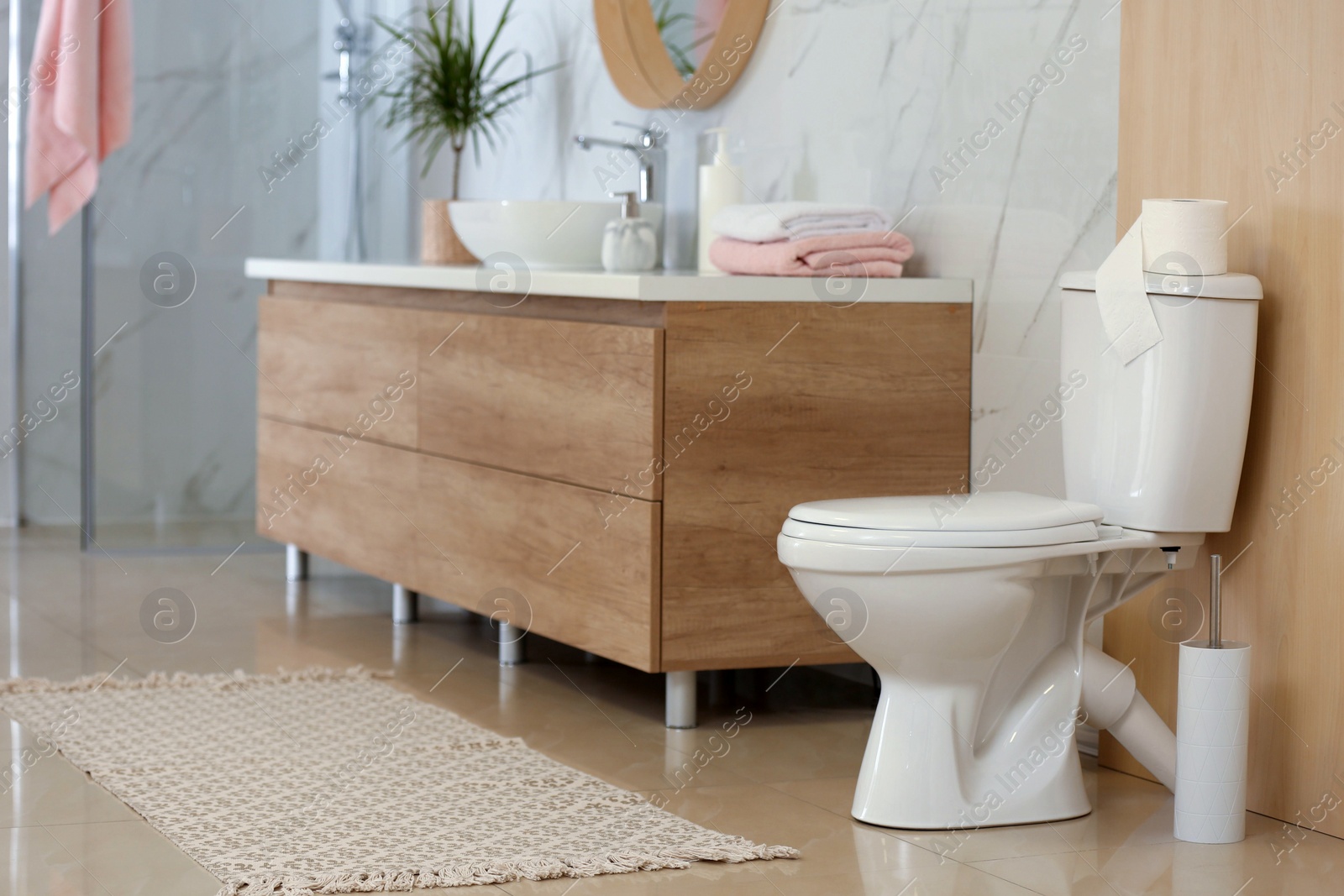 Photo of Interior of modern bathroom with toilet bowl