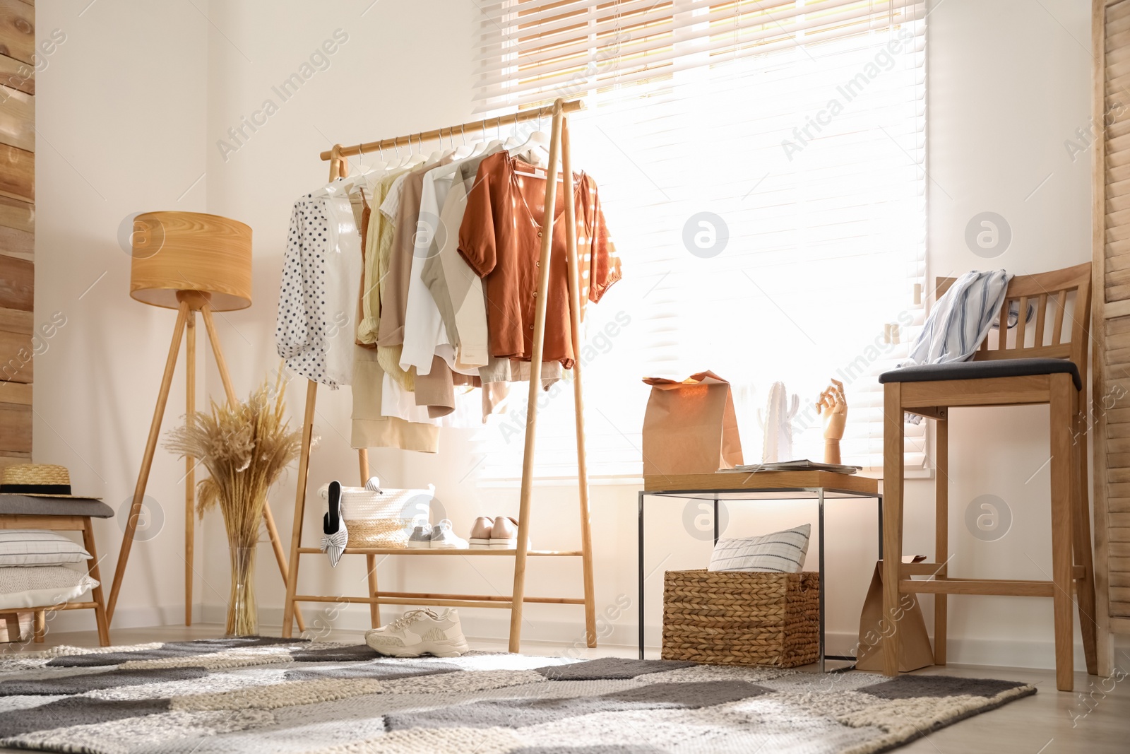 Photo of Dressing room interior with stylish wooden furniture