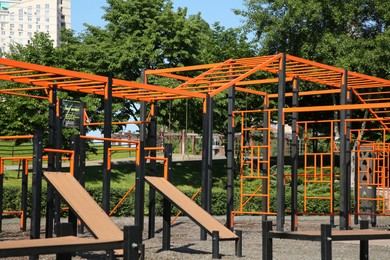 Photo of Empty outdoor gym with exercise equipment in park