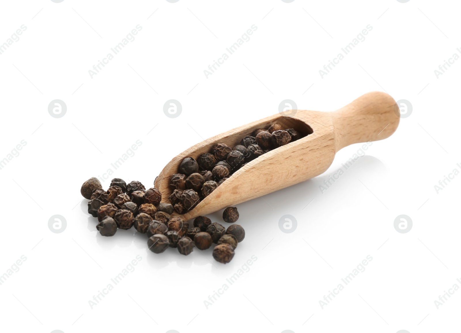 Photo of Wooden scoop with black pepper grains on white background