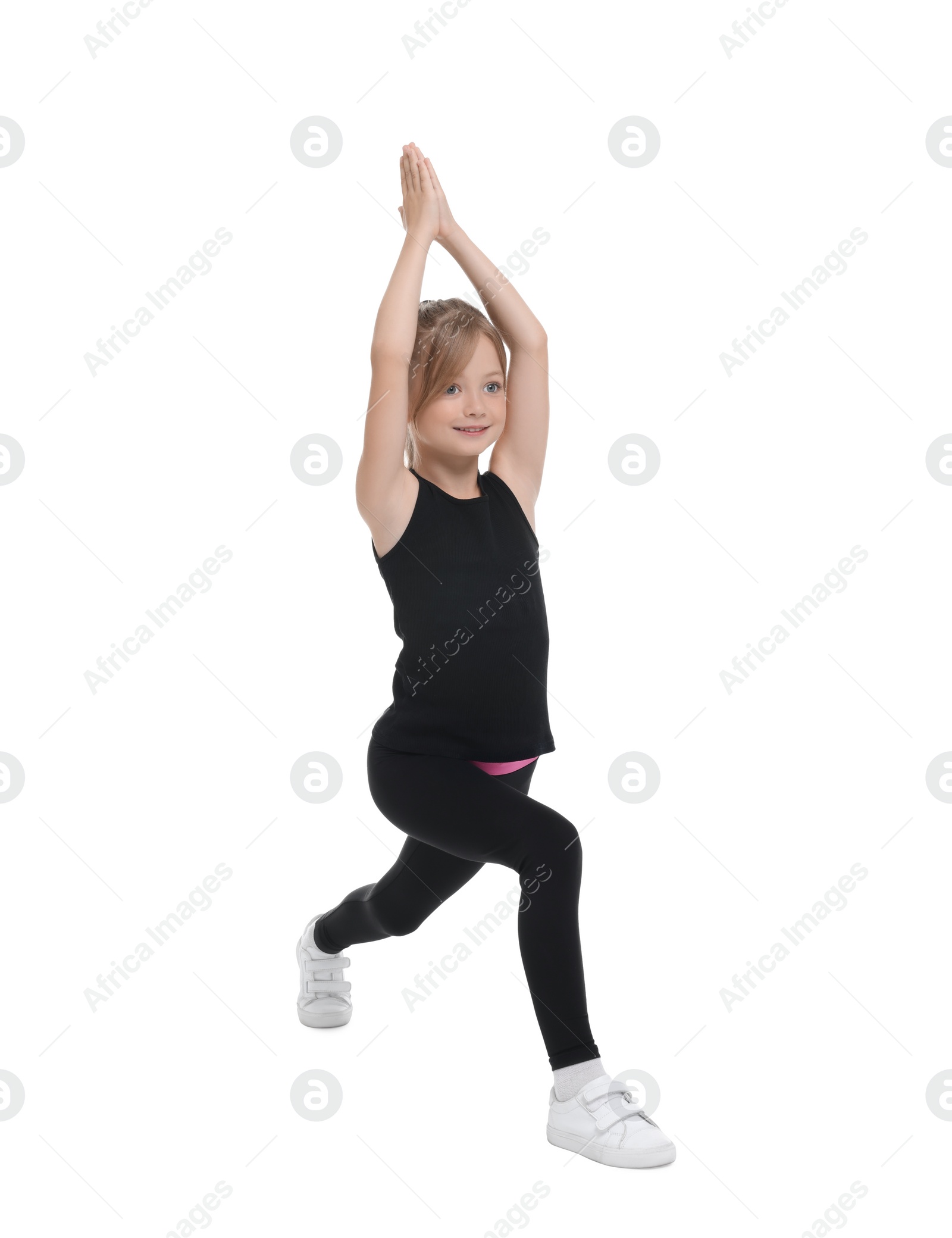 Photo of Little girl doing morning exercise on white background