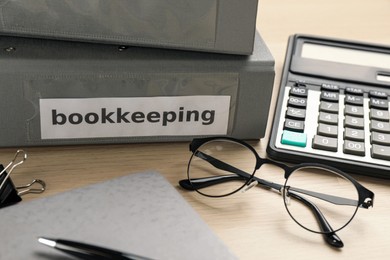 Bookkeeper's workplace with folders and documents on table