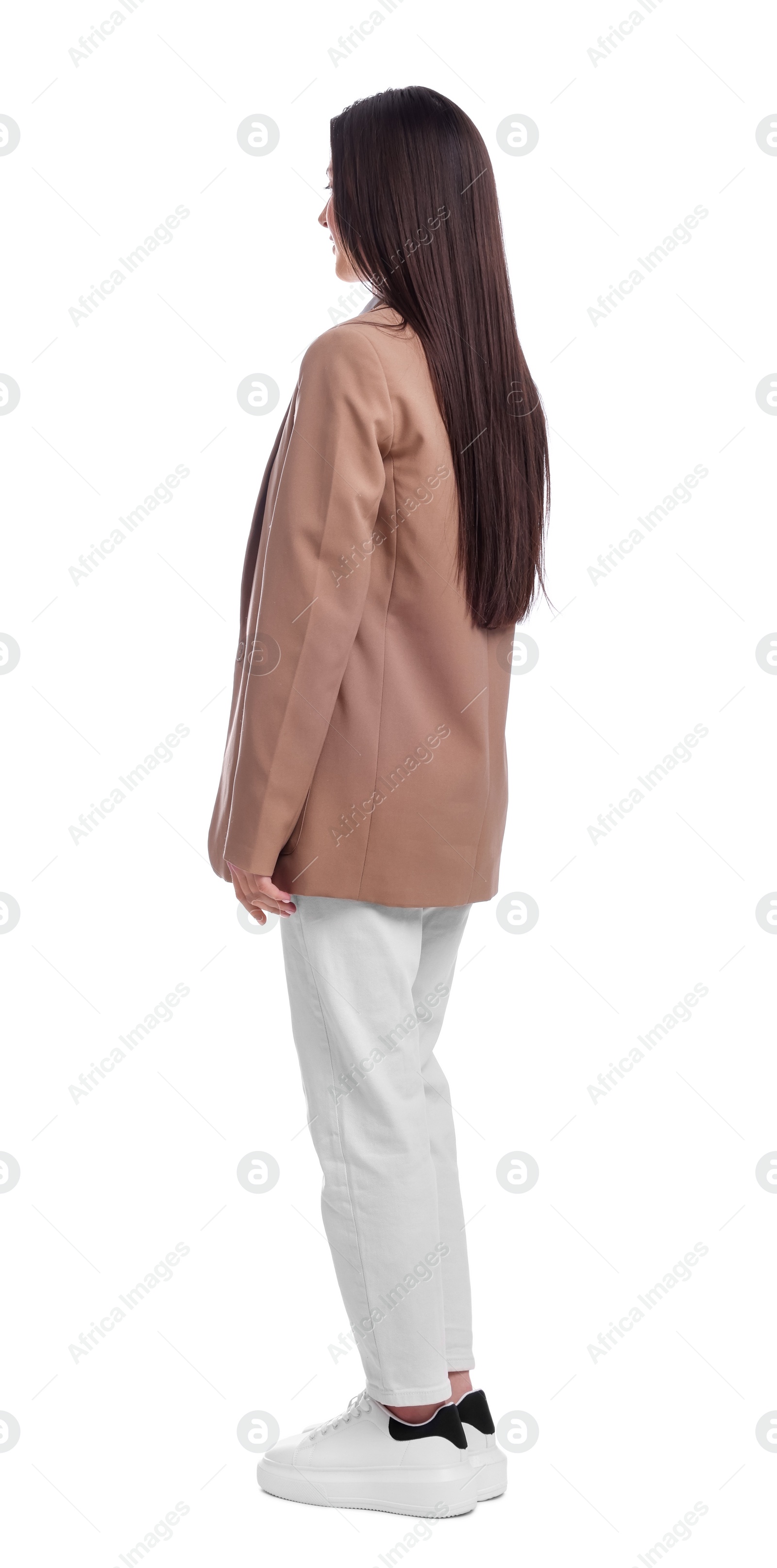 Photo of Young businesswoman in suit standing on white background