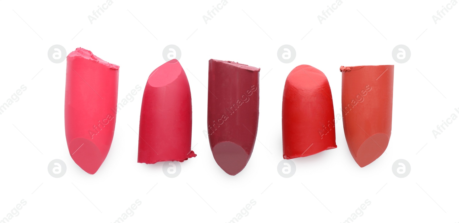 Photo of Different beautiful lipsticks on white background, top view