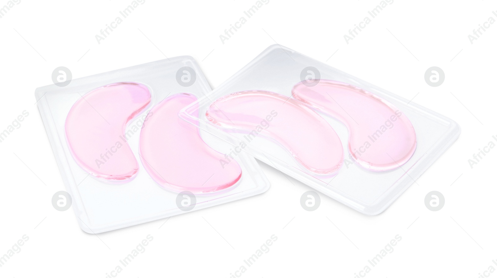 Photo of Packages with under eye patches isolated on white. Cosmetic product