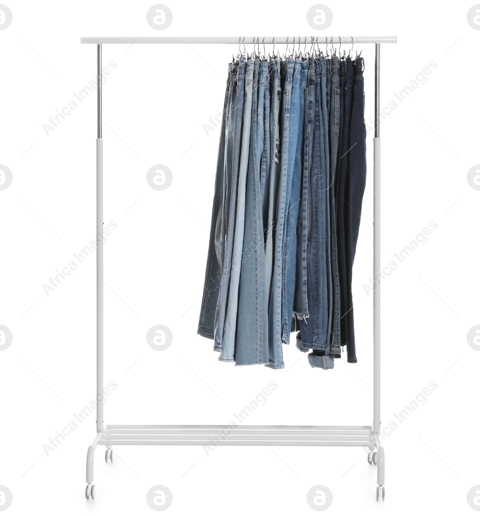 Photo of Rack with different jeans isolated on white