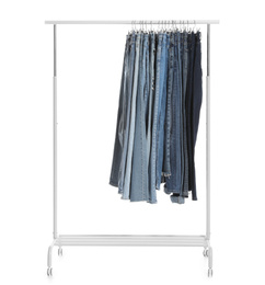 Rack with different jeans isolated on white