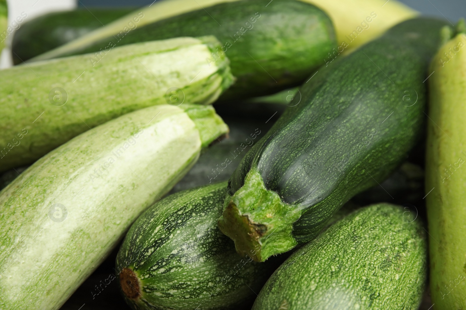 Photo of Fresh ripe green zucchini as background, closeup