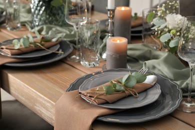 Photo of Festive table setting with beautiful floral decor indoors