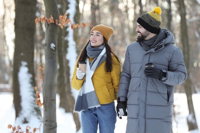 Beautiful young couple enjoying winter day outdoors