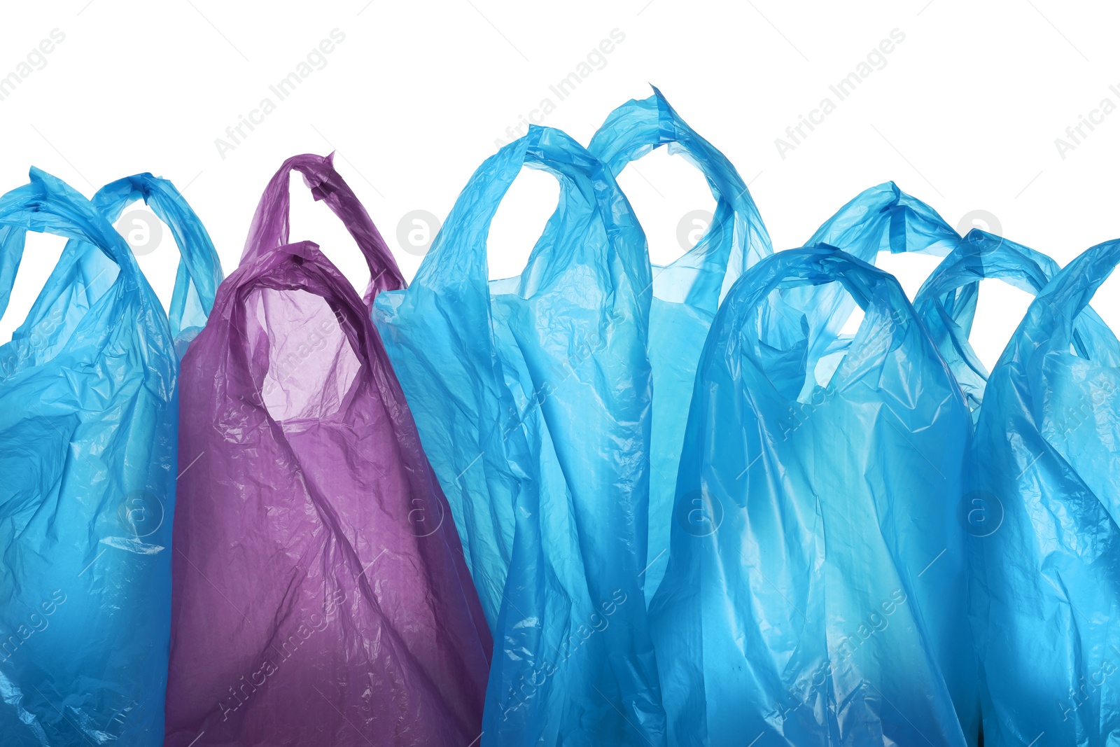 Photo of Many different plastic bags on white background