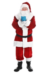 Santa Claus holding piggy bank on white background