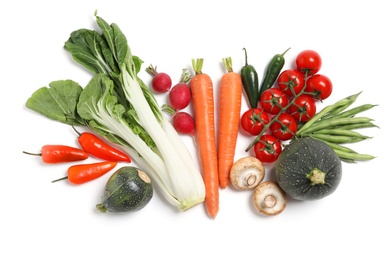 Photo of Many different fresh vegetables on white background, top view