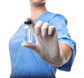 Photo of Female doctor holding ampule with vaccine on white background, closeup. Medical object