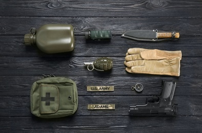 Photo of Set of military equipment on wooden background, flat lay