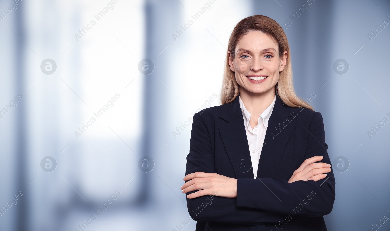 Image of Beautiful real estate agent in office, space for text