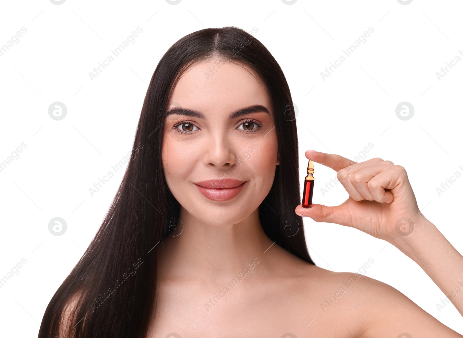 Photo of Beautiful young woman with long healthy hair holding ampoule on white background