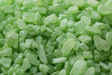 Green natural sea salt as background, closeup view