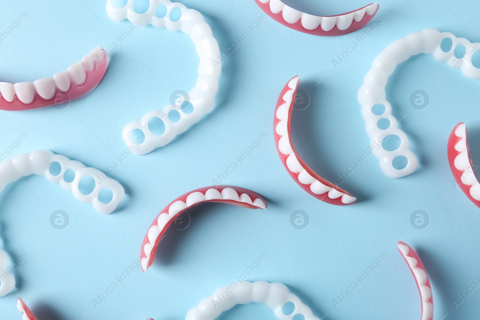 Photo of Flat lay composition with teeth covers on color background