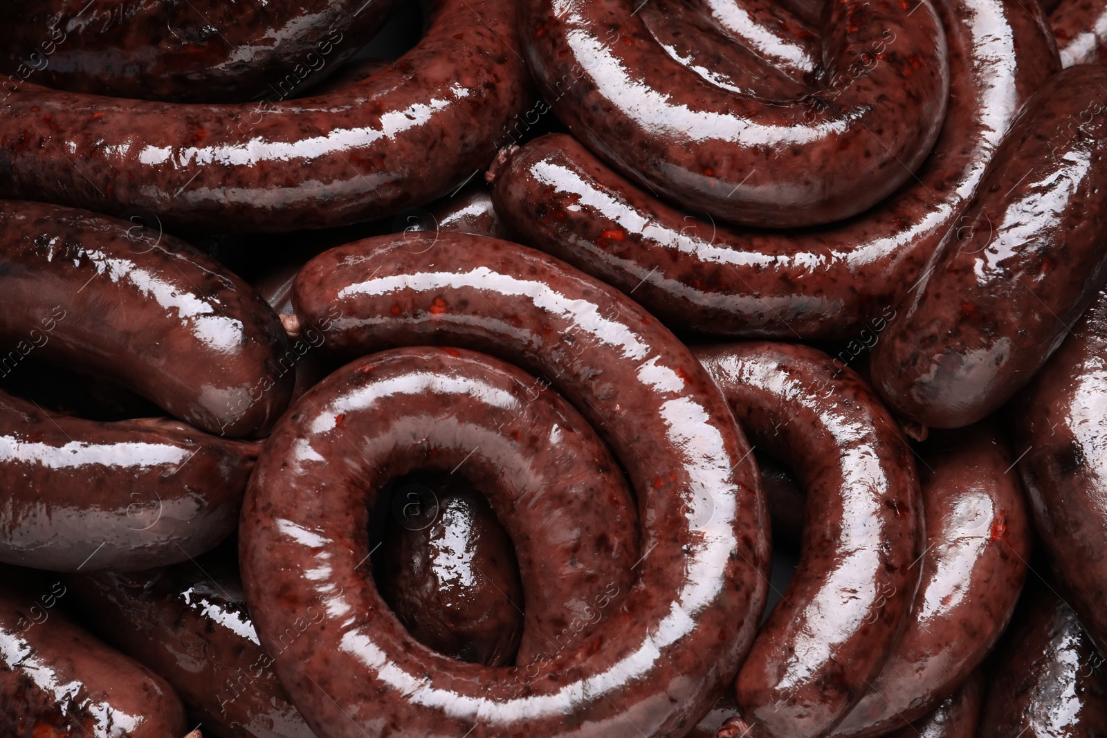 Photo of Tasty blood sausages as background, top view