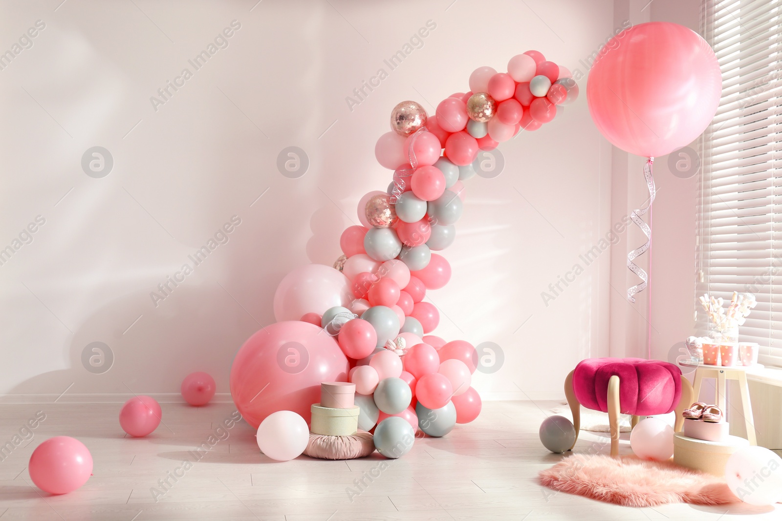 Photo of Room decorated with colorful balloons for party