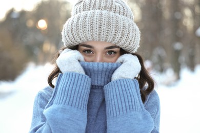 Photo of Portrait of young woman in snowy park