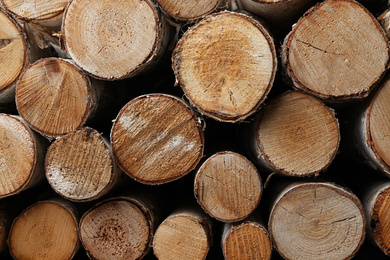 Photo of Stack of cut firewood as background, closeup view
