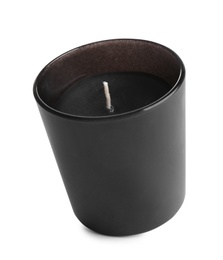 Photo of Aromatic candle in black holder isolated on white