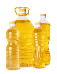 Photo of Bottles of cooking oil on white background