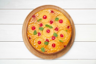 Photo of Delicious pineapple pie with cherry and mint on white wooden table, top view
