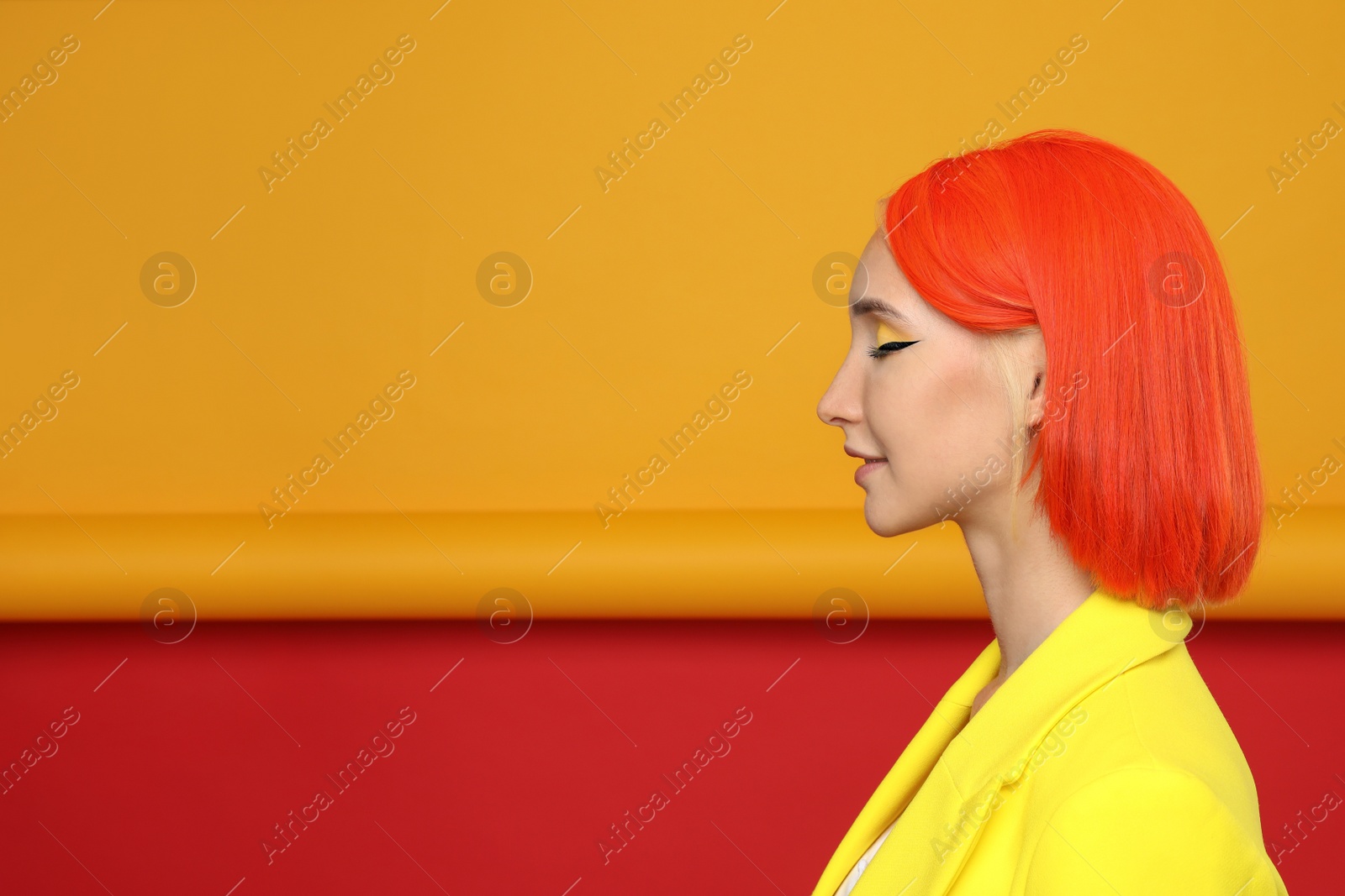 Photo of Beautiful young woman with bright dyed hair on color background, space for text