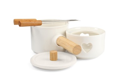 Photo of Fondue set isolated on white. Kitchen equipment