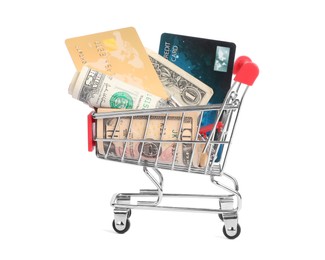 Photo of Small metal shopping cart with credit cards and dollar bills isolated on white