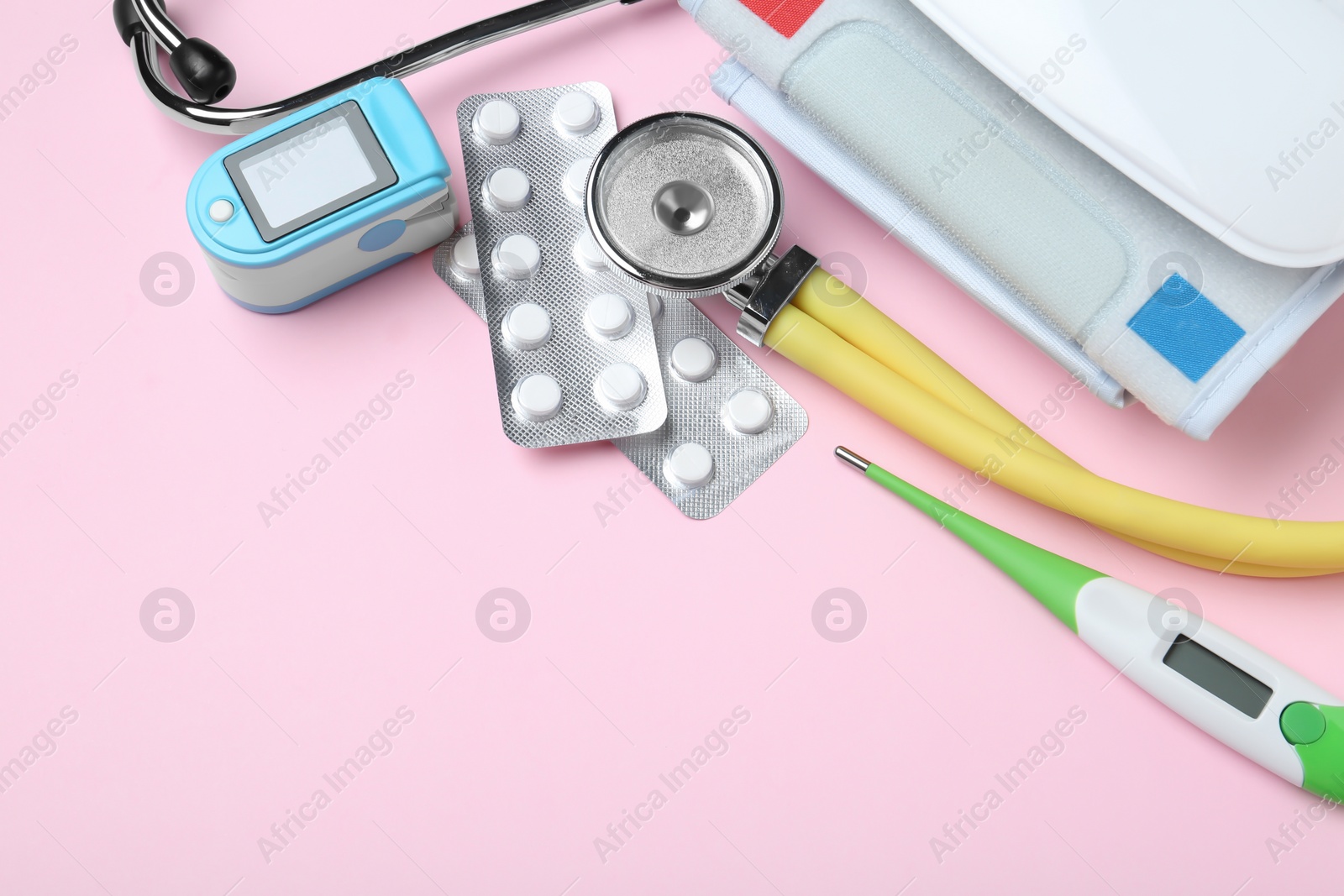 Photo of Flat lay composition with different medical objects and space for text on color background