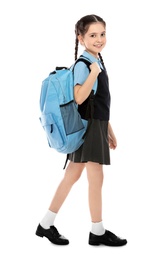 Photo of Full length portrait of cute girl in school uniform with backpack on white background