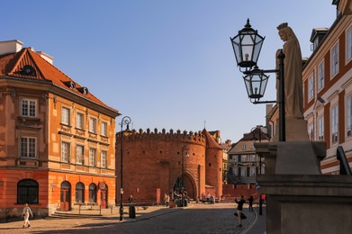 Photo of WARSAW, POLAND - MARCH 22, 2022: Beautiful view of Old Town Square on sunny day