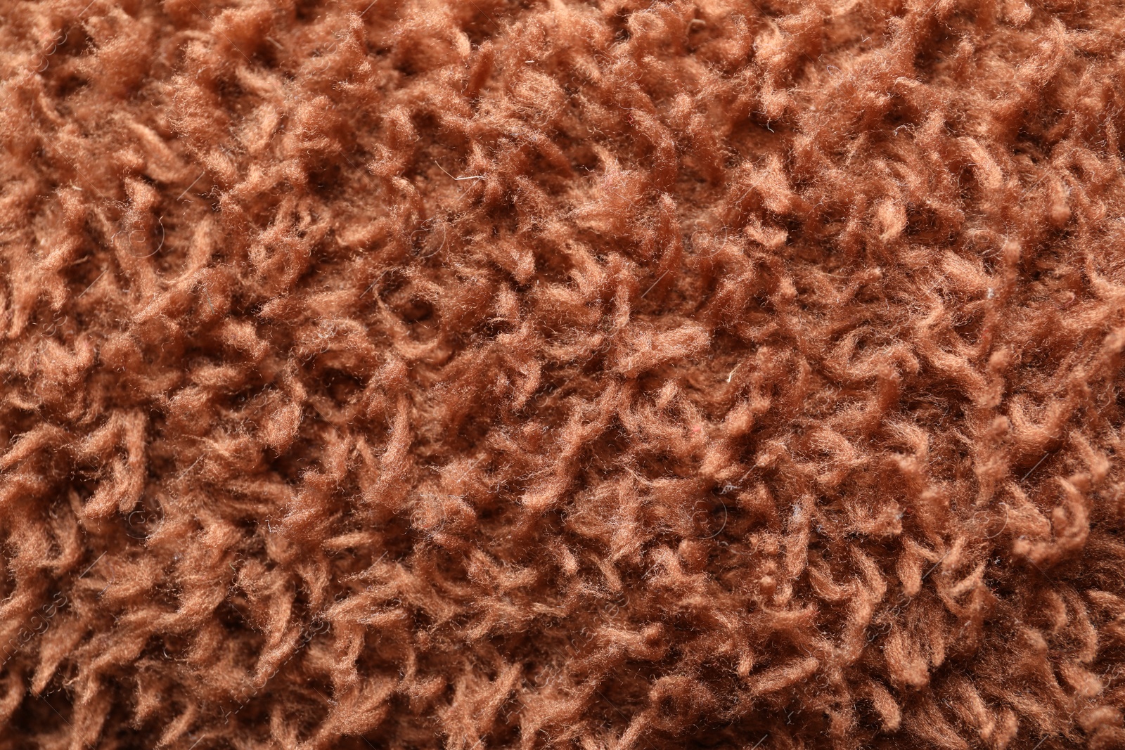 Photo of Texture of brown faux fur as background, closeup