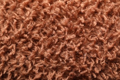 Texture of brown faux fur as background, closeup