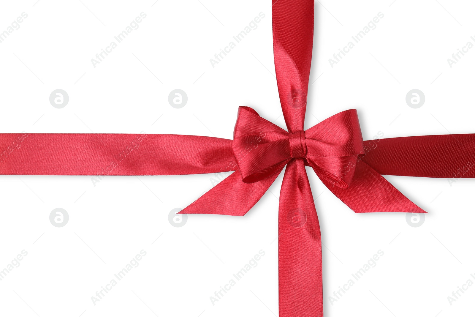 Photo of Red satin ribbon with bow on white background, top view