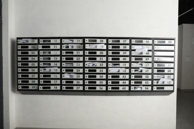 Metal mailboxes with keyholes, numbers and receipts in post office