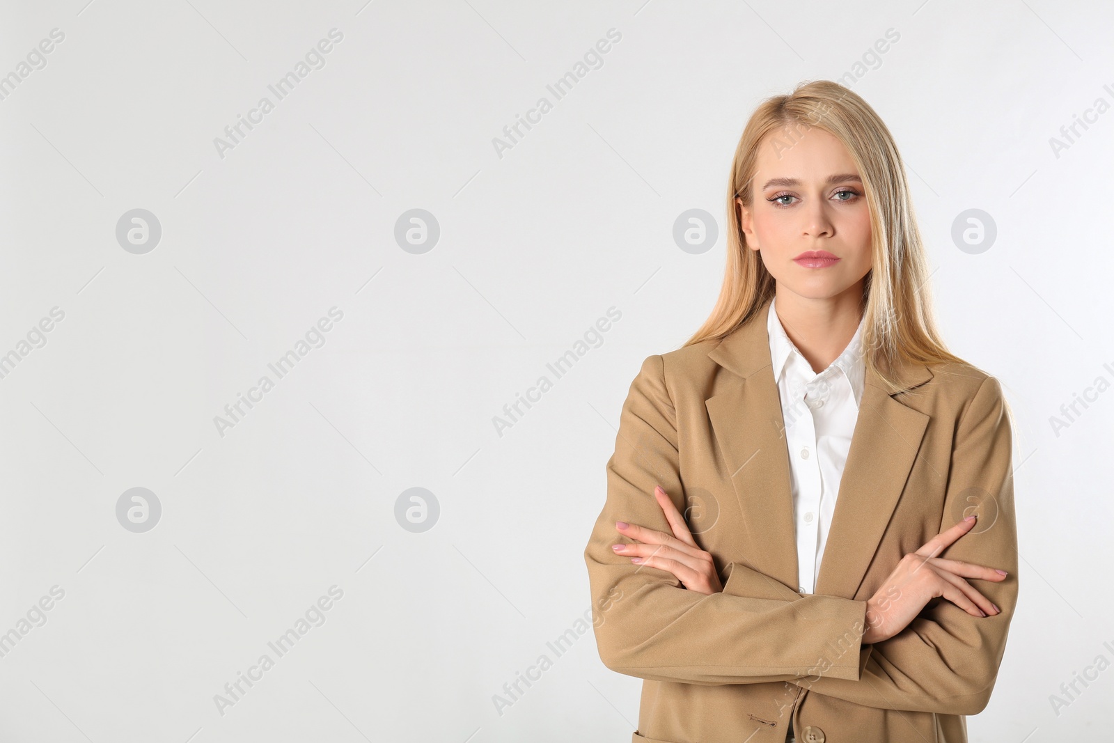 Photo of Portrait of young businesswoman on white background. Space for text
