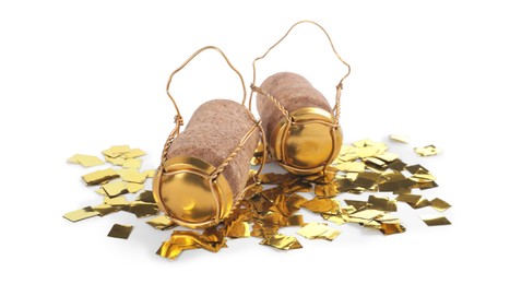 Photo of Corks of sparkling wine with muselet caps and shiny golden confetti on white background